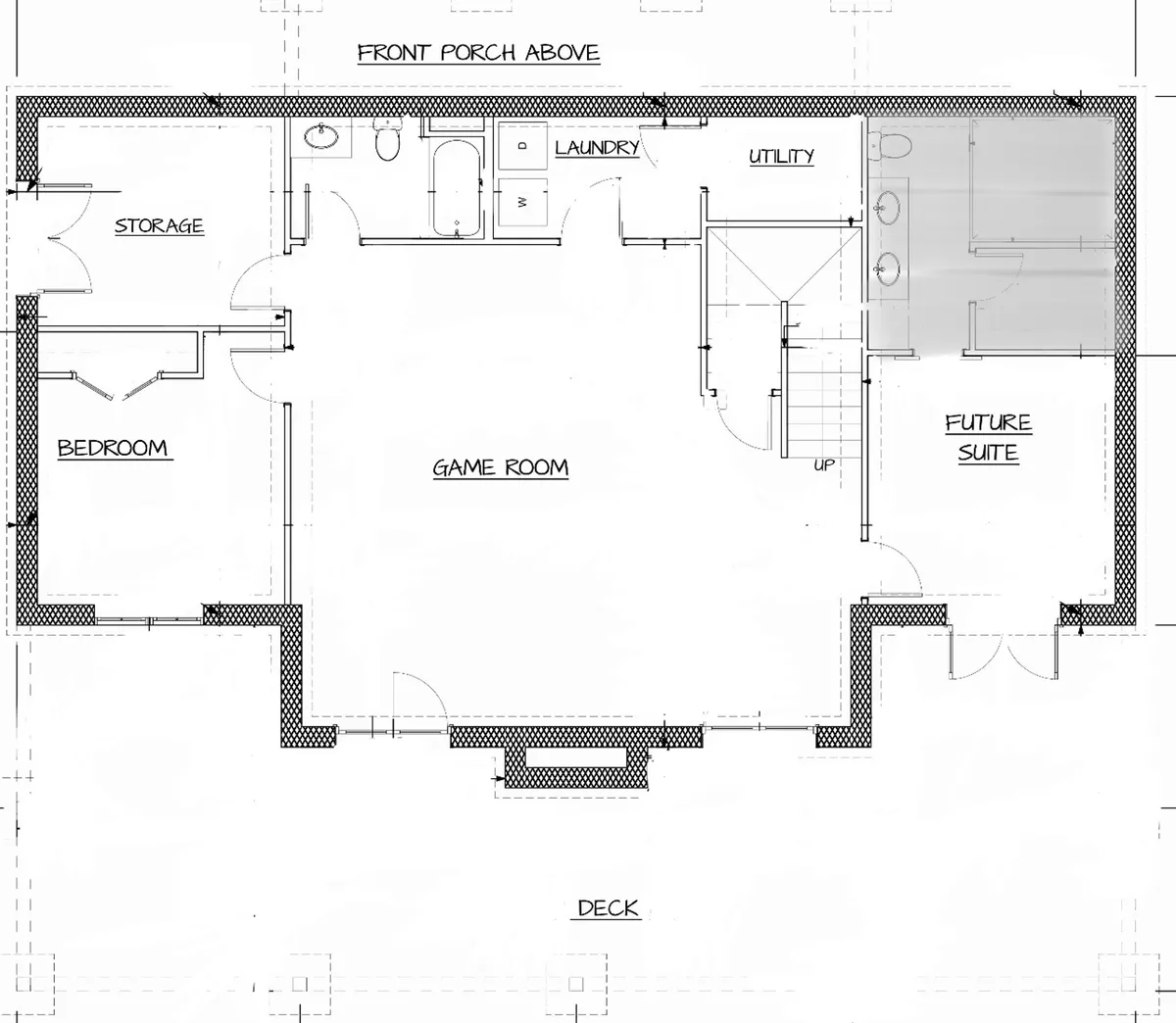 A broader view of the lower level reveals the game room, a glimpse of an adjoining suite, the laundry area, and sliding doors that lead to the deck outside. The scene feels casual, multi-functional, and family-friendly, emphasizing indoor-outdoor flow.
